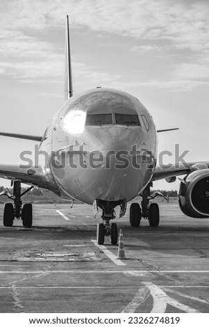airplane in the airport, black and white photo with shallow depth of field.