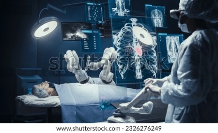 Surgeon Wearing AR Headsets And Using High-Precision Remote Controlled Robot Arms To Operate On Patient In Hospital. Doctor Controlling Robotic Limbs, Observing Organs On Holographic VFX Displays. Royalty-Free Stock Photo #2326276249
