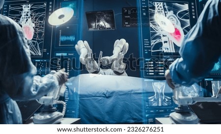 Surgeons Wearing AR Headsets, Using High-Precision Remote Controlled Robot Arms To Operate On Patient In Hospital. Doctors Working With Robotic Limbs, Observing Vitals On Holographic VFX Displays. Royalty-Free Stock Photo #2326276251