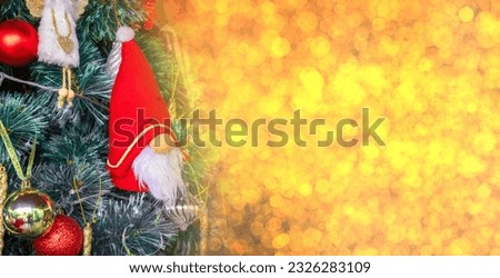 Tree pine green color santa cluas character costume cartoon red hat bokeh yellow orange color copy space merry christmas happy new year december winter calendar xmas holiday 2024 toy traditional party