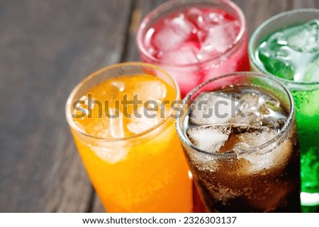 Soft drinks and fruit juice mixed with soda high in sugar have a negative effect on physical health Royalty-Free Stock Photo #2326303137
