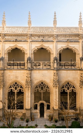 Front view of a facade of the cloister of San Juan de Los Reyes Monastery, Toledo, Spain.