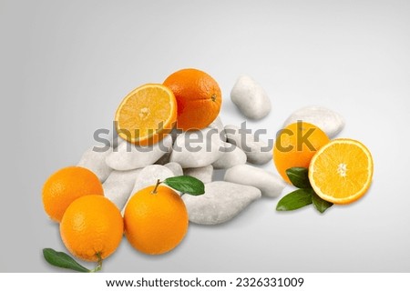 Stone podium and fresh ripe oranges fruits
