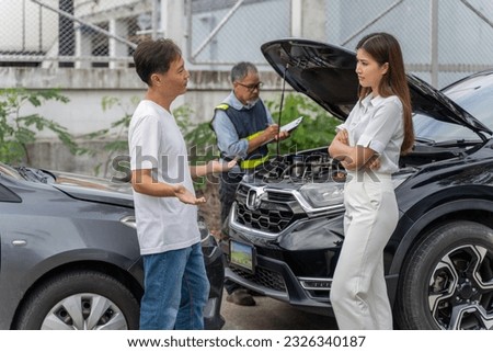 An unset young woman talking angryly to a man who accidentally drove his car and hit her car while insurance agent checking the damage of the accident Royalty-Free Stock Photo #2326340187