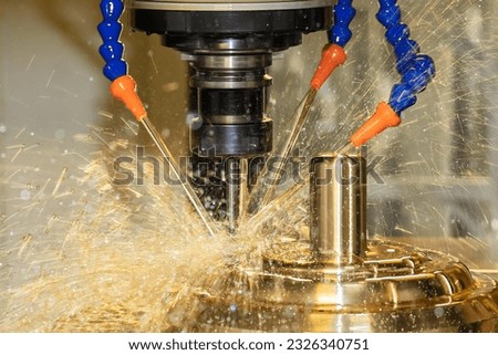 Close up scene the CNC milling machine cutting the shell mold parts with oil coolant method . The mold and die manufacturing process by machining center with the solid ball endmill tools. Royalty-Free Stock Photo #2326340751