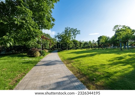 green lawn in city park Royalty-Free Stock Photo #2326344195