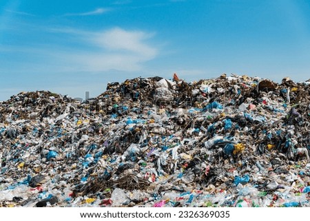 Garbage dump landscape. City landfill. Royalty-Free Stock Photo #2326369035