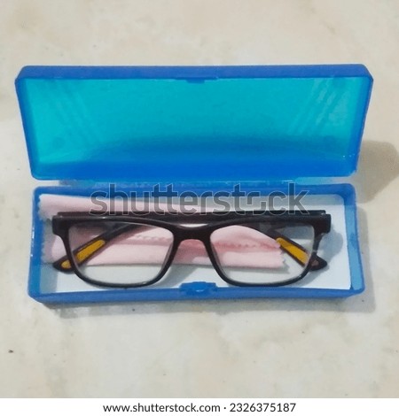 this photo shows my glasses and the box they are in. The glasses located in the box are clearly visible, showing their unique design and characteristics.