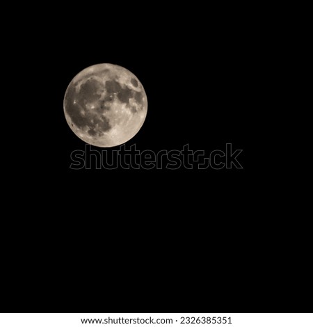 The supermoon in September 30th 2023 at night sky Depok city, harvest moon Royalty-Free Stock Photo #2326385351
