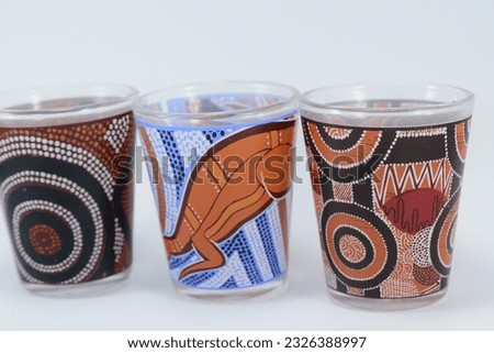 decorative glass with ethnic painting isolated on white background