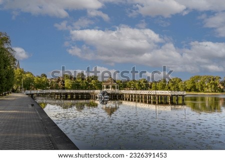 Bridge and promenade on the lake in the city of Ostroda, Poland.