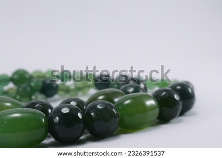 jade necklace on a white background. jade made into necklaces