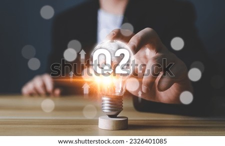 Business Profit growth, Financial report, Second quarter Concept. 2nd quarter positive growth performance report light bulb idea, increasing financial, Q2, stock, analysis, Business chart, success. Royalty-Free Stock Photo #2326401085