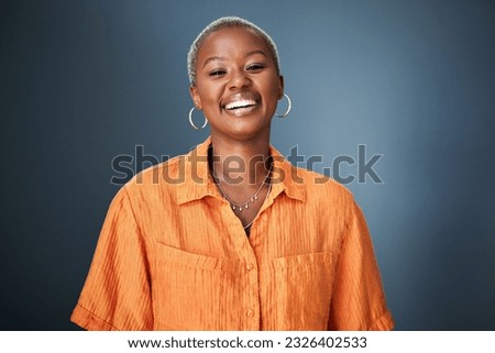 Smile, laugh and portrait of black woman laughing in studio at silly, joke or funny against a gradient grey background. Happy, laugh and face of African female with positive attitude or good vibes