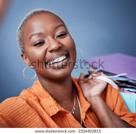 Selfie, smile and portrait of a woman with shopping bags in studio after sale, promotion or discount. Happy, excited and African female person taking picture after buying products by gray background. Royalty-Free Stock Photo #2326402815