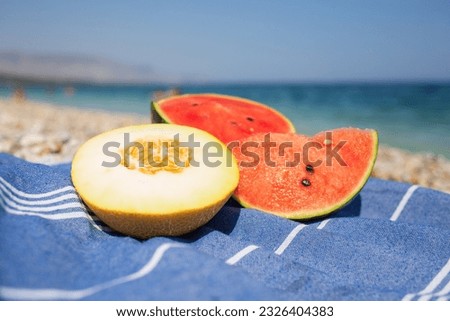slices of watermelon on the seashore
