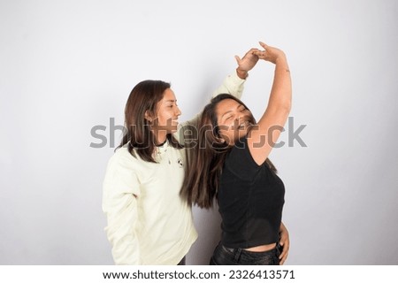 beautiful photograph of a lgbt couple on a light studio background.