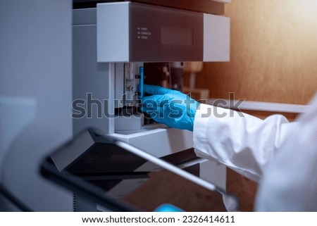 Scientist performs maintenance checks of the analytical instrument, Liquid Chromatography Mass Spectrometer LC-MS before and after use. Royalty-Free Stock Photo #2326414611