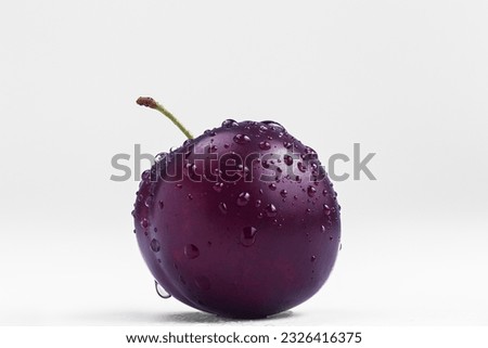 plum with water drops on a white background