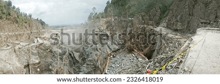 The impact of destruction from the eruption of Mount Semeru, where the second silver bridge suffered heavy damage.

Lumajang, Indonesia - December 06, 2021