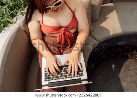 Obese Woman Vacation Traveling working on laptop in in the swimming pool holiday remote online working digital Freelance work studying online e-learning 
