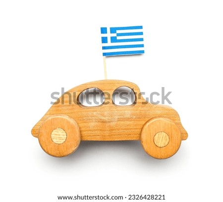 Wooden car with flag of Greece isolated on white background. Traveling concept