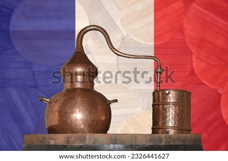 Copper alambik on the background of the national flag of France. Winemaking and distillery.