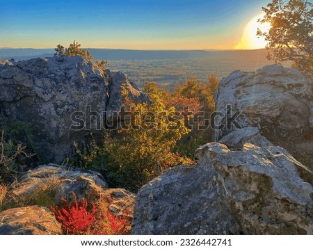 A scenic shot of Hawksbill Crag(Whitaker Point) in Newton County, Arkansas at pinky sunset Royalty-Free Stock Photo #2326442741
