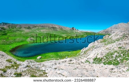 Beautiful panoramic landscape of mountain lake between Bolkar Mountain and Taurus Mountain. Nigde, Turkey. It is known black lake. Volcanic crater. Travel background.