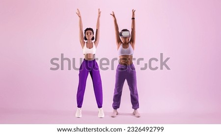 Metaverse workout session. Sporty young black woman in vr goggles exploring virtual reality fitness game as 3D avatar, stretching her body, purple studio background