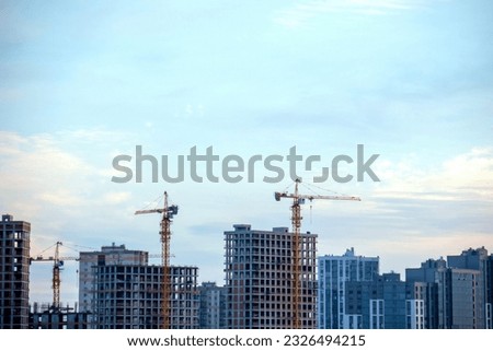 skyscrapers under construction. construction cranes. high-rise buildings