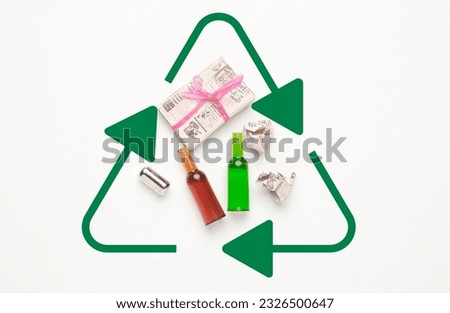 A picture of miniature rubbish and waste with recycle sign on white background. Recycle and waste management sign.
