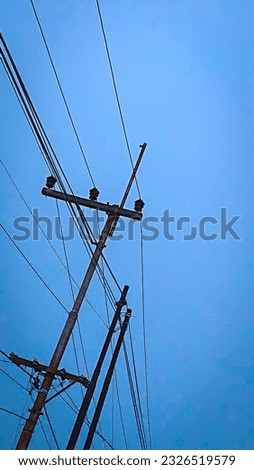Power line with cloudless blue sky