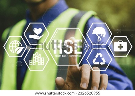 HSE - health safety environment concept.Construction inspector in uniform is checking industrial building and environment.Safe and standardized industry. Royalty-Free Stock Photo #2326520955