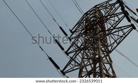 Electric cable poles, High voltage transmission network lines in Indonesia. Dual Circuit Steel pole transmission tower. Air transmission line conductor.
