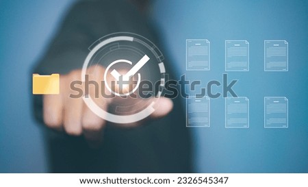 Businessman writing correct sign mark in conveying paperless workflows, quality assurance. Document online approve concept. Royalty-Free Stock Photo #2326545347