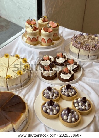 Chocolate tart, strawberry cheesecake, Carrot Cream Cheese Frosting, Fresh Baked Purple Sweet Potato Cake, Delicious taro cake on a white plate. Free space for text.  Menu cafe and coffee shop Royalty-Free Stock Photo #2326558607