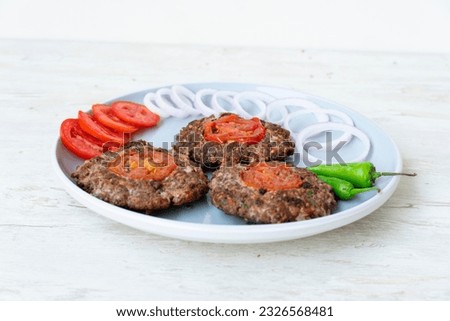 chapli kabab dish isolated on background side view pakistani food Royalty-Free Stock Photo #2326568481