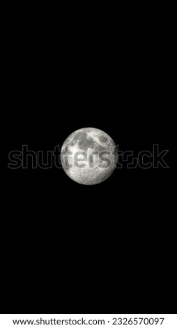 a pair of moons merging into a perfect full moon, black background