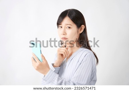 Asian middle aged woman with the smartphone thinking in white background round