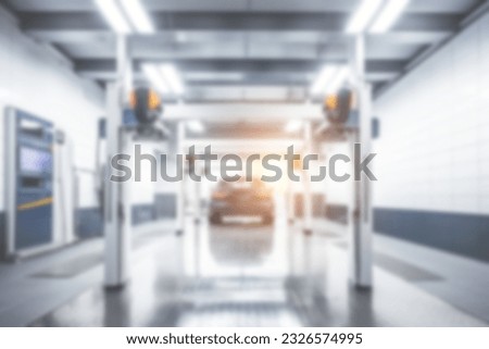 Blurred background of modern car wash bay. Royalty-Free Stock Photo #2326574995