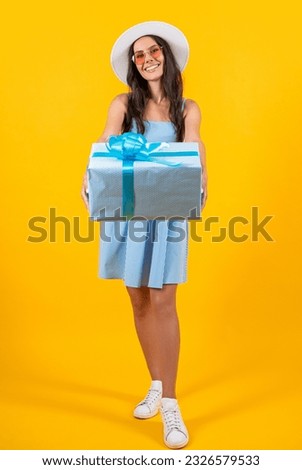 selective focus of birthday woman hold present isolated on yellow. birthday woman