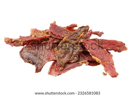 Dried lamb jerky slices isolated on white background