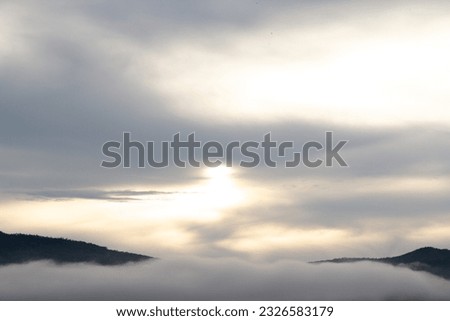 Clouds in the blue sky at sunset as an abstract background.
