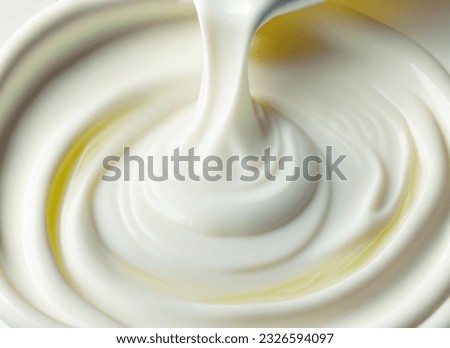 Pouring White Liquid into A Glass Royalty-Free Stock Photo #2326594097