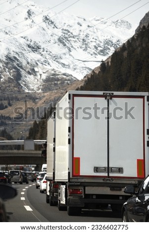 Cargo truck on the mountain highway. Delivery truck on the Europe motorway.