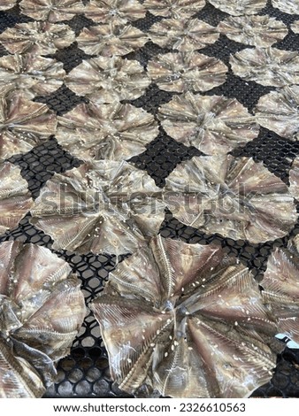 Pla Wong is the wing of the stingray that is cut into small pieces and arranged in a circle. It is then dried until it becomes a band of fish as in the picture.