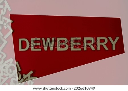 DEWBERRY in wooden English language capital letters spilling from a pile of letters on a red background framed