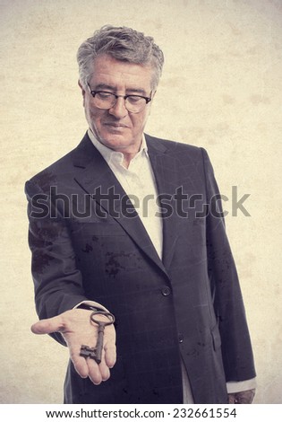 senior cool man with an old key