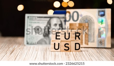 The inscription Euro USD on the background of euro banknotes and American dollars. Euro dollar currency pair Royalty-Free Stock Photo #2326625215